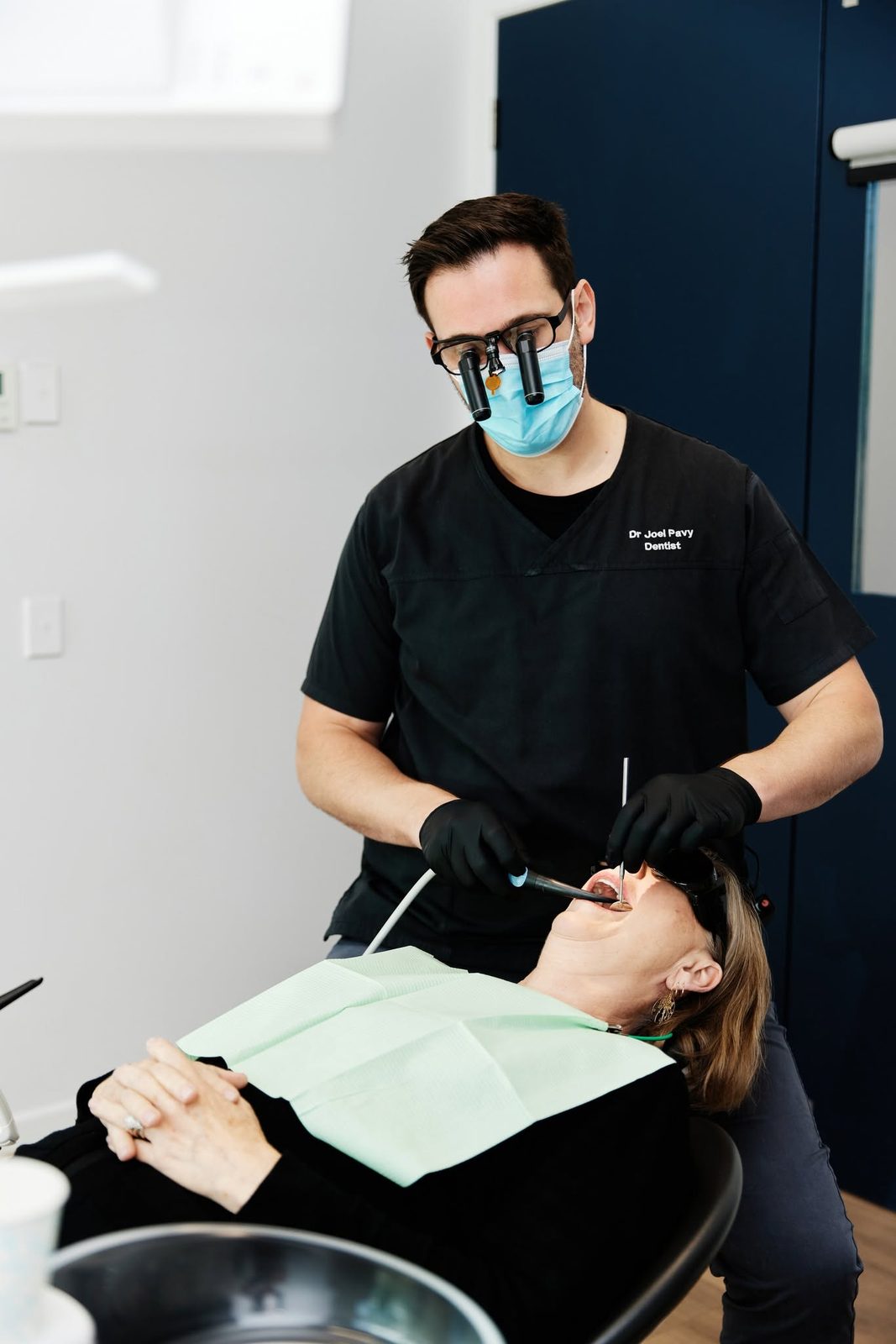 Dr Joel Pavy treating a patient in one of the surgeries