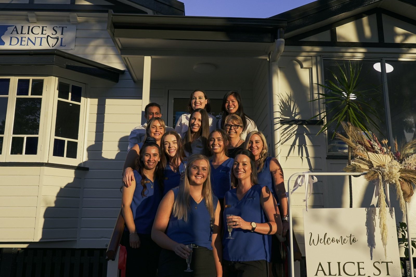 The Alice St Dental team gathered on the front steps of the practice